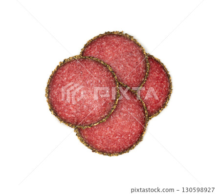 Pepper salami cuts isolated, thin sausage slices. Sliced dry chorizo, sausages round pieces 130598927