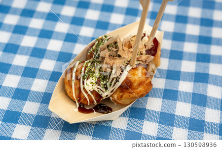 Takoyaki - traditional Japanese street food, outdoor snack with octopus Takoyaki fried balls Takoyaki - traditional Japanese street food, outdoor snack with octopus Takoyaki fried balls 130598936