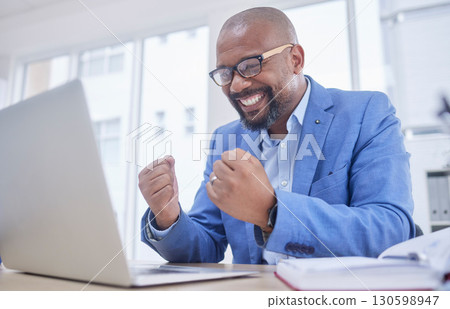 Black man, laptop and fist celebration in office for web design success, happiness or winner achievement. African businessman, celebrate and happy hands for online communication on digital device Black man, laptop and fist celebration in office for web design success, happiness or winner achievement. African businessman, celebrate and happy hands for online communication on digital device 130598947