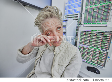 Elderly woman, ophthalmology and eye pain with hand in clinic consultation for vision, wellness and healthcare. Senior patient, visual problem and assessment for eyes, headache and medical solution 130598966