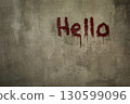 Art shabby grey plastered wall with the inscription hello in blood, copy space. 130599096