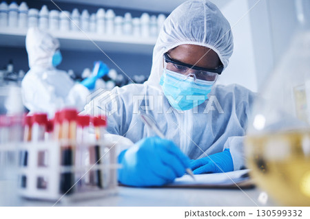 Black woman doctor writing checklist in laboratory with notebook for research, medical exam and sample analysis. Healthcare, biotechnology or scientist for medicine, dna results or vaccine report Black woman doctor writing checklist in laboratory with notebook for research, medical exam and sample analysis. Healthcare, biotechnology or scientist for medicine, dna results or vaccine report 130599332