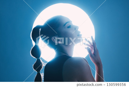 Magical, beautiful and face of a girl with lighting isolated on a dark background in a studio. Idea, creative and woman thinking of futuristic glow from light, art and cosmetics on a backdrop Magical, beautiful and face of a girl with lighting isolated on a dark background in a studio. Idea, creative and woman thinking of futuristic glow from light, art and cosmetics on a backdrop 130599356