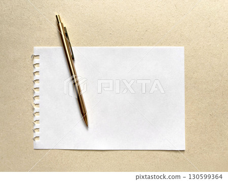 A page from a sketchbook and a gold pen 130599364