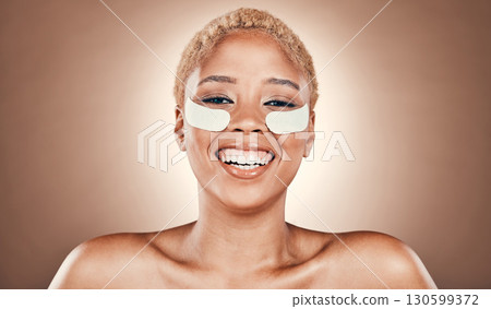 Beauty, eyes and patch with portrait of black woman for skincare, cosmetics or collagen. Spa, facial and self care with girl model and mask product for health, glow or salon in studio background Beauty, eyes and patch with portrait of black woman for skincare, cosmetics or collagen. Spa, facial and self care with girl model and mask product for health, glow or salon in studio background 130599372