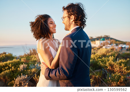 Love, happy and wedding with couple in nature for celebration, happiness and romance. Sunset, hug and affectionate with man and woman in embrace at countryside for ceremony, marriage and smile Love, happy and wedding with couple in nature for celebration, happiness and romance. Sunset, hug and affectionate with man and woman in embrace at countryside for ceremony, marriage and smile 130599562