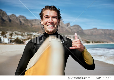 Shaka hand sign, beach and surfer with surfboard for fitness, fun and adventure on vacation. Sports, travel and portrait of man with chill gesture for surfing by the ocean on holiday in South Africa. Shaka hand sign, beach and surfer with surfboard for fitness, fun and adventure on vacation. Sports, travel and portrait of man with chill gesture for surfing by the ocean on holiday in South Africa. 130599652