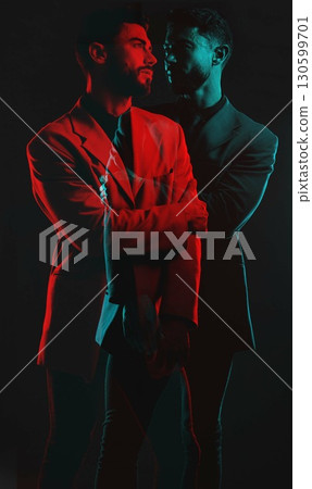 Fashion, double exposure and man in dark studio and neon lighting in vintage clothes, elegant and classy suit. Creative aesthetic, shadow and male model with luxury, designer and stylish clothes Fashion, double exposure and man in dark studio and neon lighting in vintage clothes, elegant and classy suit. Creative aesthetic, shadow and male model with luxury, designer and stylish clothes 130599701
