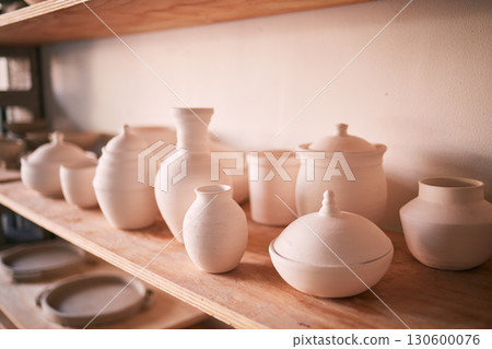 Pottery background, ceramics and shelf in workshop, creative store or manufacturing startup. Clay products, collection and display in studio, small business and retail craft shop of stock production Pottery background, ceramics and shelf in workshop, creative store or manufacturing startup. Clay products, collection and display in studio, small business and retail craft shop of stock production 130600076