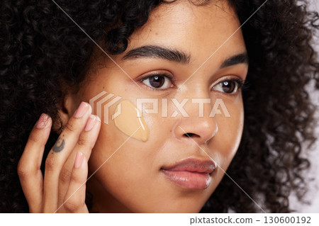 Black woman, beauty and face, foundation and makeup, cosmetics product zoom and cream on studio background. Hand, skin and wellness with dermatology, cosmetic care and sunscreen with African female Black woman, beauty and face, foundation and makeup, cosmetics product zoom and cream on studio background. Hand, skin and wellness with dermatology, cosmetic care and sunscreen with African female 130600192