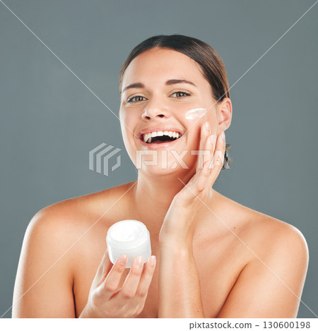 Woman apply cream for face, happy in portrait and beauty, skincare and moisturizer isolated on studio background. Sunscreen, lotion and healthy skin with glow, cosmetics and facial treatment product Woman apply cream for face, happy in portrait and beauty, skincare and moisturizer isolated on studio background. Sunscreen, lotion and healthy skin with glow, cosmetics and facial treatment product 130600198