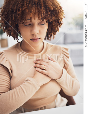 Black woman, breathing exercise and stress mindfulness of a remote worker doing meditation. Breathe, heart rate awareness and meditating young female try to relax with zen activity in a house 130600227