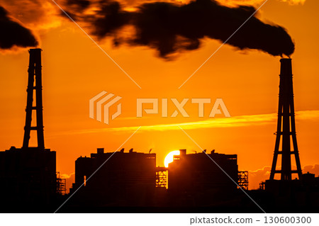 Factory silhouette and rising sun 130600300