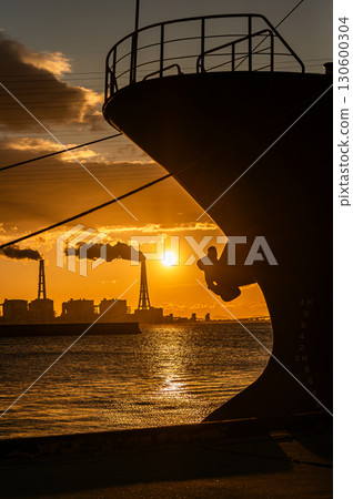 Factory silhouette, ship and rising sun Factory silhouette, ship and rising sun 130600304