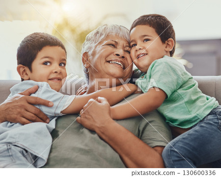 Children, hug and grandmother on a sofa, happy and smile, love and laugh while bonding on their home visit. Kids, grandchildren and boy embrace grandma on a couch, relax and hugging in a living room Children, hug and grandmother on a sofa, happy and smile, love and laugh while bonding on their home visit. Kids, grandchildren and boy embrace grandma on a couch, relax and hugging in a living room 130600336