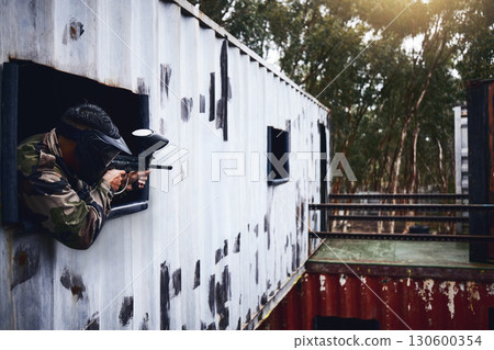 Paintball, gun or player in a shooting game with war action on a fun battlefield on holiday vacation. Military mission, fitness or man aiming with weapons gear for survival in an outdoor competition 130600354