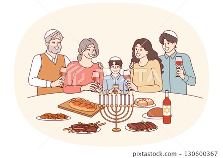 Jewish family at festive table with minor, drinks red wine and eats traditional food Jewish family at festive table with minor, drinks red wine and eats traditional food 130600367