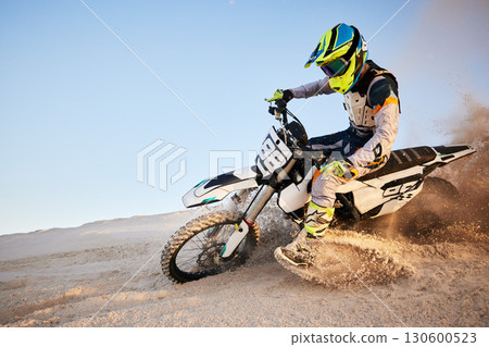 Desert, moto cross or sports adventure athlete in sand for exercise, workout or speed. Travel, dirt and bike with energy of man in Dubai race on dirt with challenge and sport fitness with freedom Desert, moto cross or sports adventure athlete in sand for exercise, workout or speed. Travel, dirt and bike with energy of man in Dubai race on dirt with challenge and sport fitness with freedom 130600523