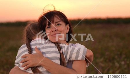 mother woman parent female, child girl kid childhood outdoors, Mother and daughter hugging in a field, Woman embracing child at sunset, Family love and togetherness, Warm evening outdoors, Parent and mother woman parent female, child girl kid childhood outdoors, Mother and daughter hugging in a field, Woman embracing child at sunset, Family love and togetherness, Warm evening outdoors, Parent and 130600531
