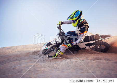 Moto cross, sand hill or man on bike for extreme sport workout, sunset ride or exercise on dirt. Nature, sky or person riding for speed adventure in Dubai desert for training, fitness or race Moto cross, sand hill or man on bike for extreme sport workout, sunset ride or exercise on dirt. Nature, sky or person riding for speed adventure in Dubai desert for training, fitness or race 130600565