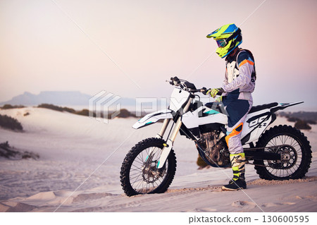 Moto cross, sand landscape or man on bike stop for sport workout, sunset ride or exercise on hill. Nature, sky or male on motorcycle freedom adventure in Dubai desert for training, fitness or race Moto cross, sand landscape or man on bike stop for sport workout, sunset ride or exercise on hill. Nature, sky or male on motorcycle freedom adventure in Dubai desert for training, fitness or race 130600595