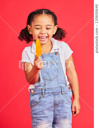 Kid, laughing and ice cream on isolated red background with fashion, cool or trendy clothes for summer holiday, break or vacation. Happy, child or girl with lolly, cold sweet and food for heat relief 130600646