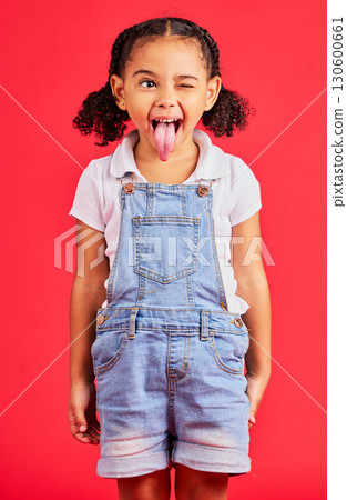 Child, face and tongue out on isolated red background in goofy, silly games and playful facial expression. Happy, kid and funny little girl with comic, emoji and winking charades in studio activity Child, face and tongue out on isolated red background in goofy, silly games and playful facial expression. Happy, kid and funny little girl with comic, emoji and winking charades in studio activity 130600661
