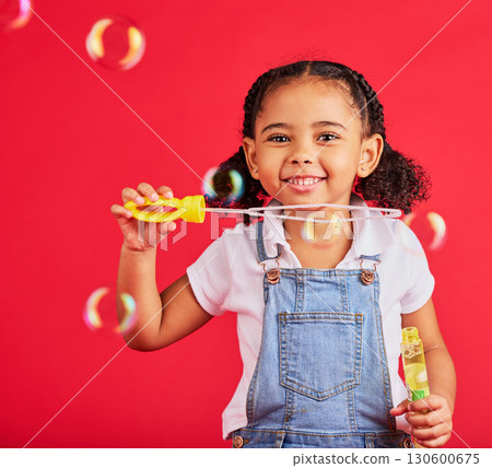 Little girl, portrait or bubbles playing on isolated red background in hand eye coordination, kids activity or fun game. Smile, happy or child and soap wand, studio toy or breathing development skill Little girl, portrait or bubbles playing on isolated red background in hand eye coordination, kids activity or fun game. Smile, happy or child and soap wand, studio toy or breathing development skill 130600675