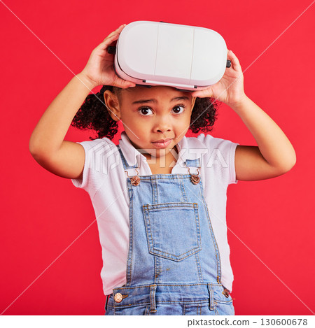 Portrait, virtual reality and metaverse for thinking child, 3d esports games or futuristic cyber gaming on red background. Vr headset, digital and technology for gamer, confused kid or wondering girl 130600678