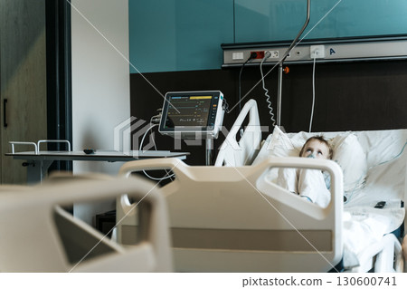 Child Patient Lying in Hospital Therapy Room Child Patient Lying in Hospital Therapy Room 130600741