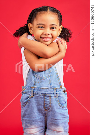 Portrait, hug and girl in studio for self love, sweet and loving gesture against red background with mockup. Face, child and happy, smile and toddler embracing, care and confident while isolated Portrait, hug and girl in studio for self love, sweet and loving gesture against red background with mockup. Face, child and happy, smile and toddler embracing, care and confident while isolated 130600742