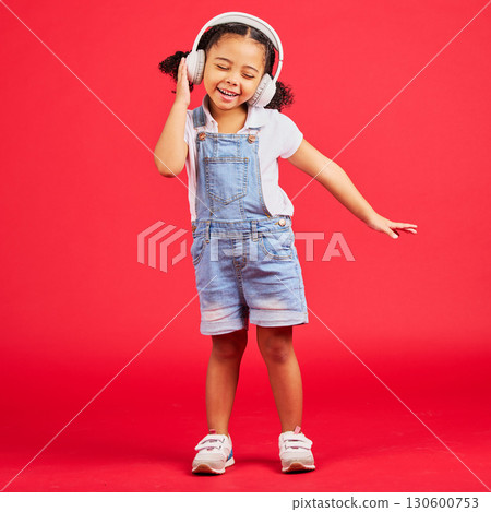 Dancing, energy or little girl on music headphones, fun radio or childrem podcast on isolated red background. Smile, happy or dancer kid listening to audio, sound and streaming media on studio mockup Dancing, energy or little girl on music headphones, fun radio or childrem podcast on isolated red background. Smile, happy or dancer kid listening to audio, sound and streaming media on studio mockup 130600753