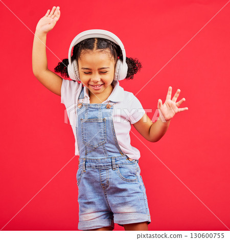 Dance, energy and happy child on music headphones, fun radio and dancing podcast on isolated red background. Smile, girl and dancer kid listening to audio, streaming sound and media on studio mockup 130600755
