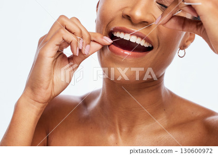 Tooth, floss and black woman face, flossing for teeth whitening, healthcare and hygiene isolated on white background. Oral care product, dental and mouth cleaning for fresh breath in studio Tooth, floss and black woman face, flossing for teeth whitening, healthcare and hygiene isolated on white background. Oral care product, dental and mouth cleaning for fresh breath in studio 130600972