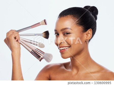Beauty, make up and brush for face on woman portrait in studio for powder, cosmetics and natural skin. Aesthetic model person with facial tools for healthy glow and smile isolated on white background 130600995