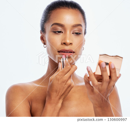 Lipstick, beauty and makeup by woman cosmetic product and mirror isolated in studio white background. Face, dermatology and model with elegant and smooth skin as self care or skincare routine Lipstick, beauty and makeup by woman cosmetic product and mirror isolated in studio white background. Face, dermatology and model with elegant and smooth skin as self care or skincare routine 130600997