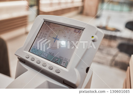 Optometry, healthcare and screen for an eye test in a clinic for eye care, health or wellness. Ophthalmology, medical and digital machine for a vision exam or eyesight assessment in a optical store. 130601085