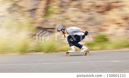 Skateboard, motion and mountain with man in road for speed, freedom and summer break. Sports, adventure and motion blur with guy skating fast in street for training, gen z and balance in nature 130601131