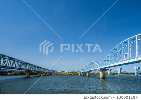 Water pipe bridge and Hankyu Senri Line railway bridge downstream of the Yodogawa River Dam, Osaka City 130601197