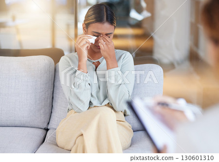 Mental health, woman and employee in therapy session, crying and conversation in office. Female, patient and lady on sofa, depression or counselling for stress, grief or loss with anxiety or recovery 130601310