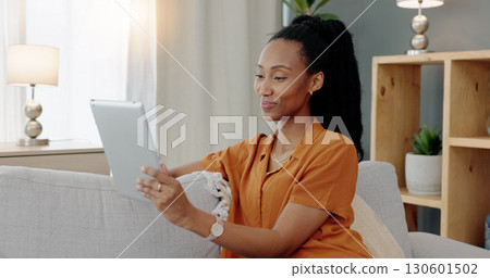Video call, lounge and tablet with black woman in virtual meeting on sofa in home living room. Discussion, communication and smile with African female person and online conversation on app with chat Video call, lounge and tablet with black woman in virtual meeting on sofa in home living room. Discussion, communication and smile with African female person and online conversation on app with chat 130601502