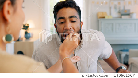Lunch, happy and couple eating pasta together at a dining room table in their house. Love, food and woman feeding her boyfriend fa dinner meal on a date in their modern home together for bonding. Lunch, happy and couple eating pasta together at a dining room table in their house. Love, food and woman feeding her boyfriend fa dinner meal on a date in their modern home together for bonding. 130601507