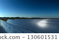 Solar panel background of photovoltaic modules for renewable energy. Clouds and blue sky in mirror. Alternative electricity source. 3d rendering. 3d illustration 130601531
