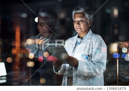Medical, research and night with doctor and tablet for planning, medicine and schedule. Technology, review and digital with senior woman reading report for healthcare, science and life insurance news 130601679