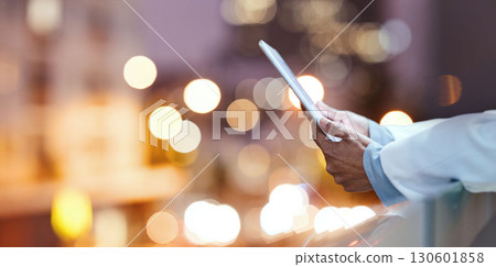Bokeh, tablet hands and doctor on hospital rooftop working on telehealth, research or online consultation in city. Healthcare, woman and physician with technology for wellness app in clinic at night Bokeh, tablet hands and doctor on hospital rooftop working on telehealth, research or online consultation in city. Healthcare, woman and physician with technology for wellness app in clinic at night 130601858