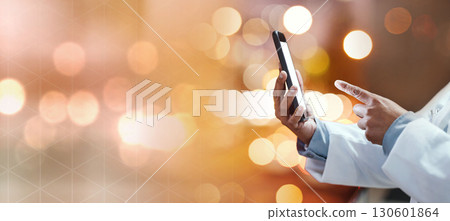 Closeup, doctor and finger with smartphone, telehealth and searching online with bokeh background. Medical professional, cellphone and typing for research, diagnosis and innovation with healthcare 130601864
