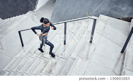 Training, above and woman running on stairs for power, sports and body energy in the city. Challenge, exercise and athlete runner with cardio on steps for a marathon, health and workout performance 130601883