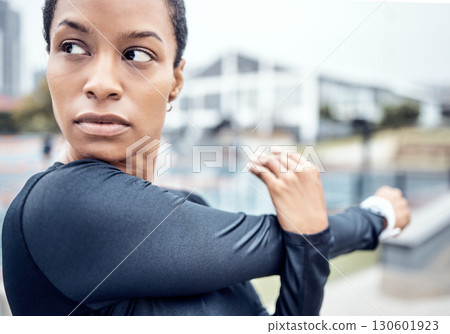 Fitness, stretching arms and black woman in city with motivation, focus and commitment for workout. Sports, body performance and face of girl warm up ready for exercise, running and marathon training 130601923
