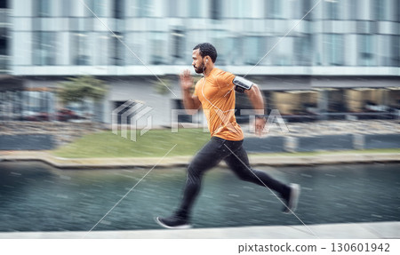 Blurred, fitness and man running as exercise in the city training, workout and workout outdoors in a town. Athlete, runner and fit male sprint fast for wellness, cardio and health lifestyle 130601942
