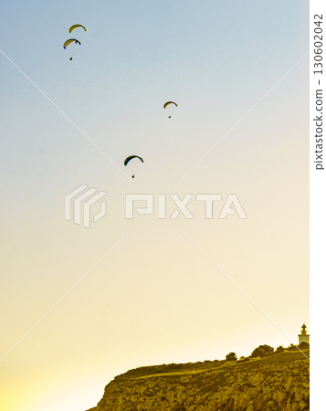 Paragliders flying in sky. 130602042
